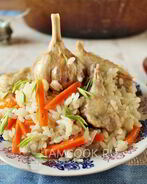 Плов с курицей в утятнице на плите