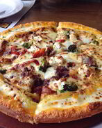 Пицца Деликатесная