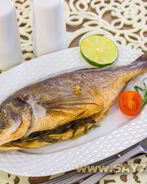 Дорадо, маринованная в соевом соусе, запеченная с травами