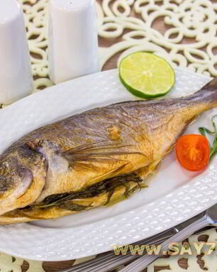 Дорадо, маринованная в соевом соусе, запеченная с травами