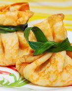 Блинные мешочки с жюльеном из красной рыбы